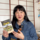 Fabienne holding the 2026 Lonely Planet Paris Guidebook