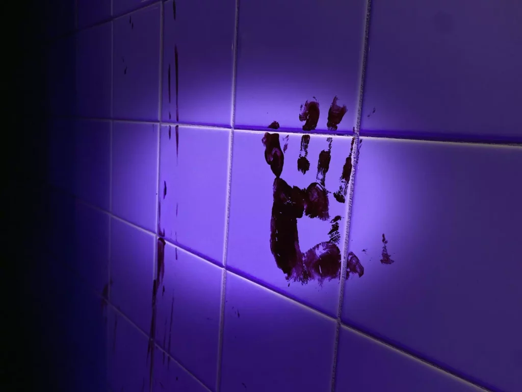Bloody hand print on a wall from an escape room