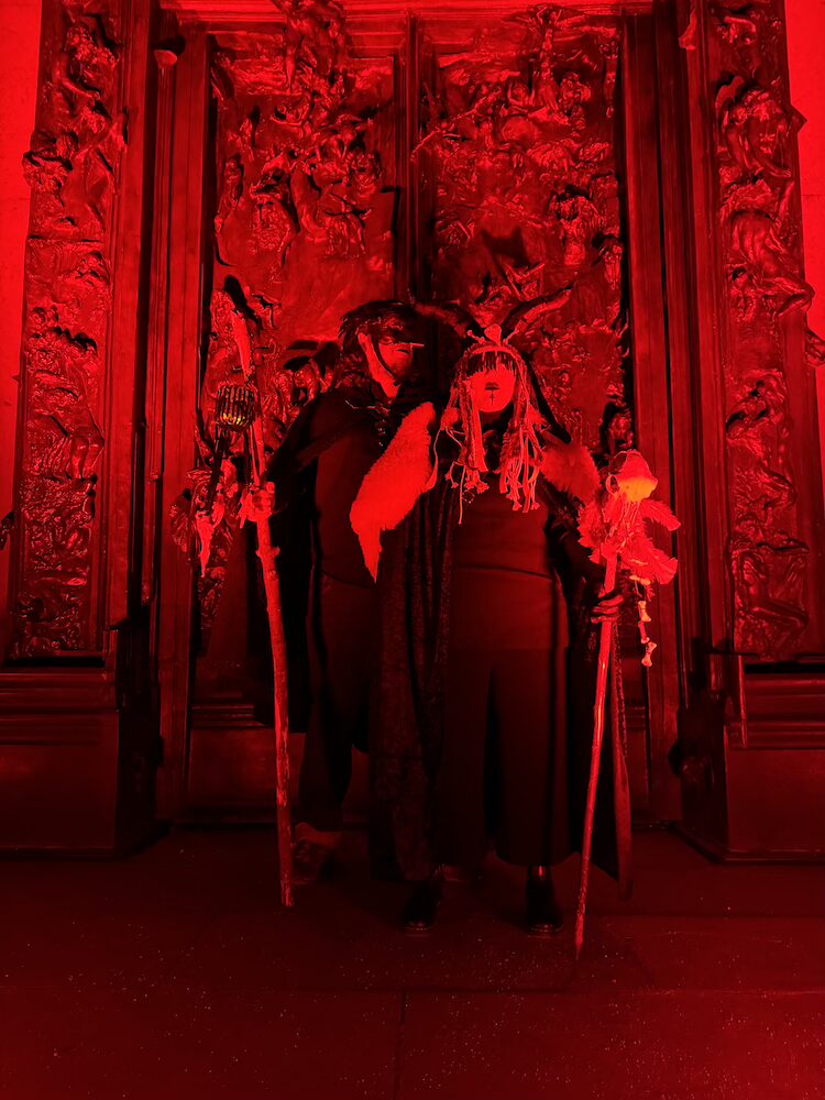 Costumes for Halloween in front of Rodin gates of Hell